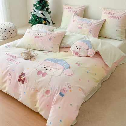 Angled view of pastel mint puppy bedding with large appliqué dog design, gradient color base, and embroidered playful accents