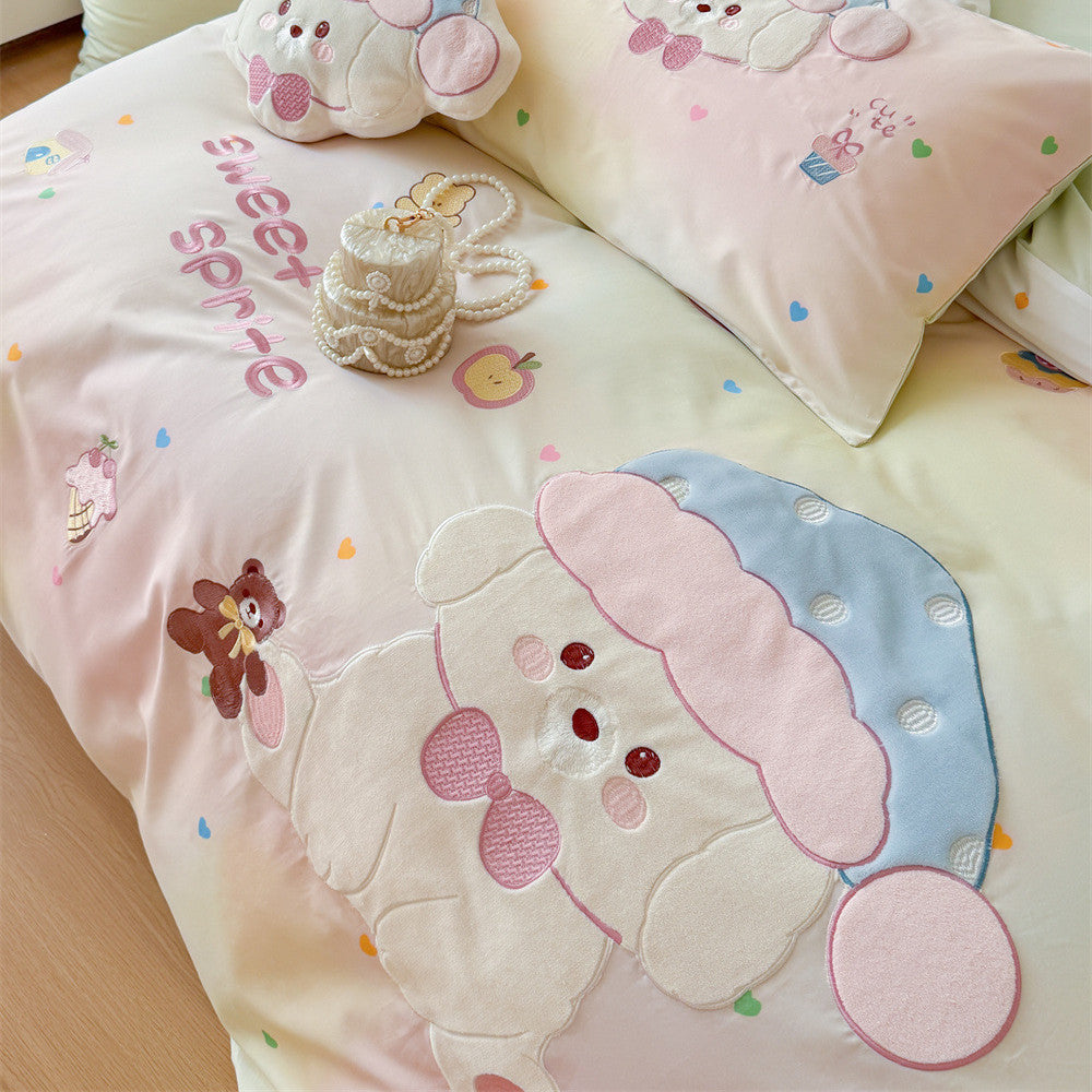 Detailed close-up of pastel mint gradient kids bedding with appliqué puppy, teddy bear embroidery, and soft cotton fabric