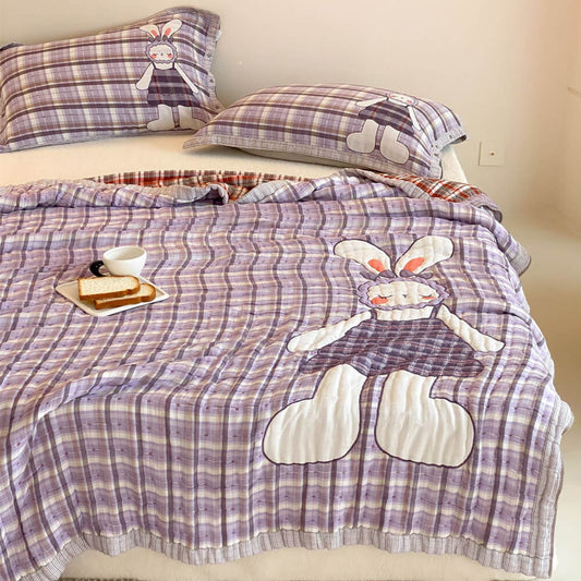 urple bunny kids comforter in quilted cotton muslin with matching plaid pillowcases on a bed