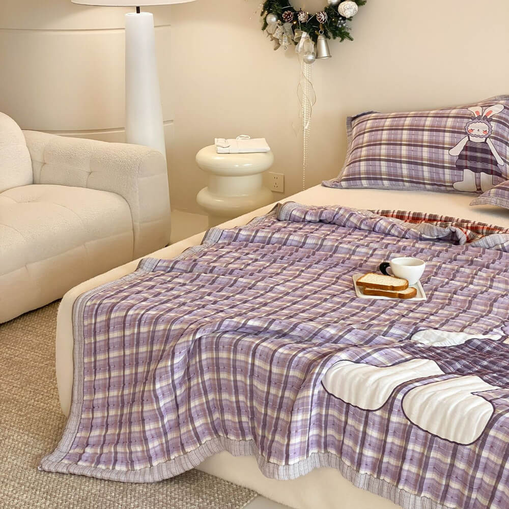 Purple plaid bunny kids comforter styled on a bed with soft quilted texture and cozy room decor