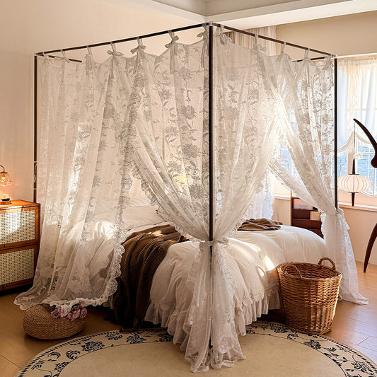 Bedroom with a canopy bed featuring lace curtains and a basket on the floor.