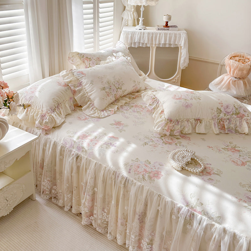 Three-quarter view of the Romantic Garden Bed Skirt in Cream Blossom, showing its elegant drape, lace detail, and coordinating bedding.