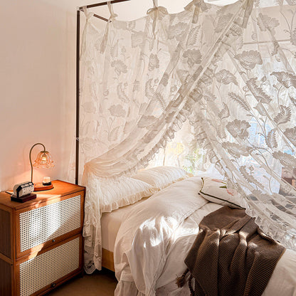 Bedroom with a canopy bed and wooden nightstand