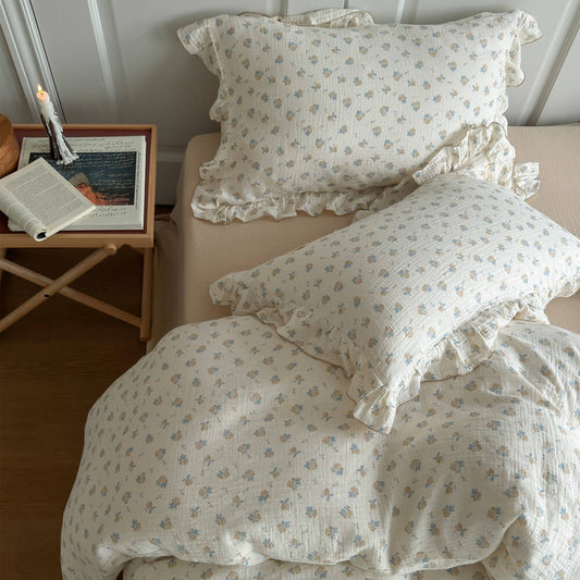 Blue rosebud cottage duvet cover set with ruffled edges and matching floral pillows
