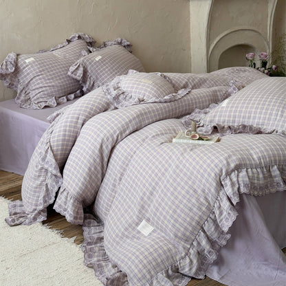 Cozy lavender plaid bedding set styled in a rustic bedroom