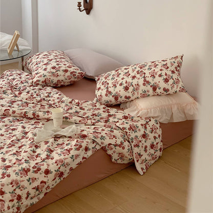 Full display of the Soft & Romantic Vintage Rose Knit Cotton Bedding Set in a cozy corner bedroom setting.