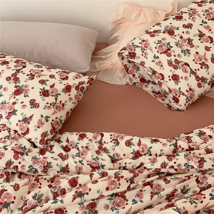 Overhead view of the Rose Knit Cotton Bedding Set, showcasing the full vintage floral duvet and pillow arrangement.