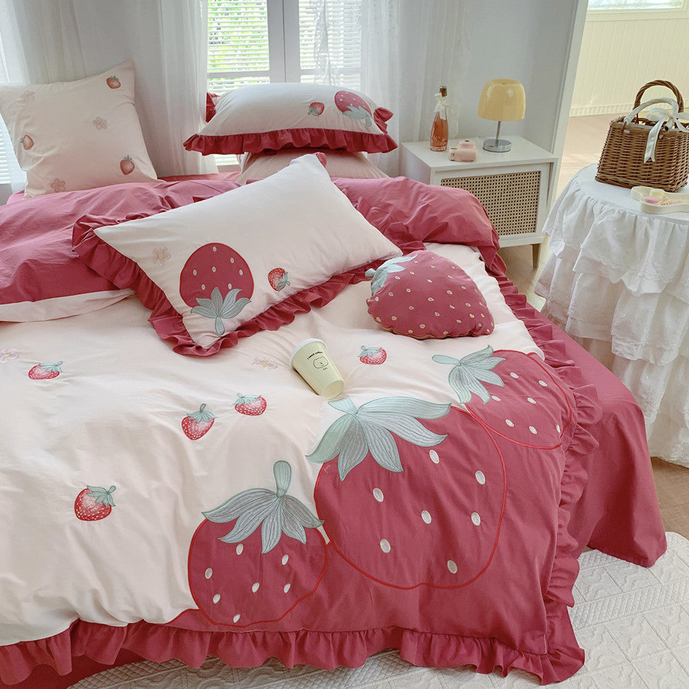 Bedding set with strawberry design in a bedroom setting