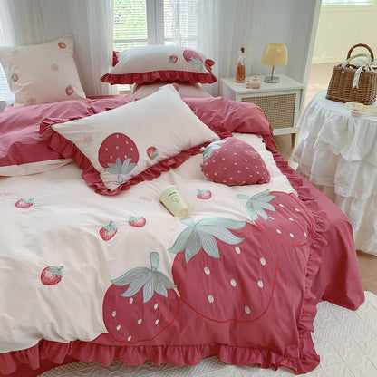 Bedding set with strawberry design in a bedroom setting