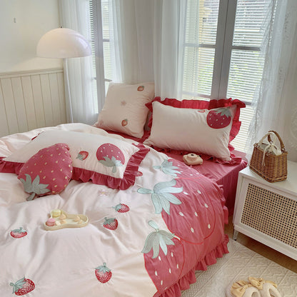 Bedroom with strawberry-themed bedding and decor