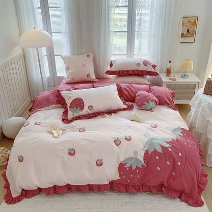 Bedding set with strawberry design in a bedroom
