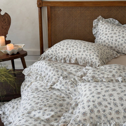 Ruffled vintage bouquet duvet cover set styled with soft florals and warm wood bedroom decor