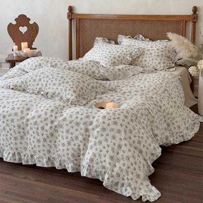 Vintage bouquet teen duvet cover set with muted florals, ruffled trim, and ivory cotton muslin