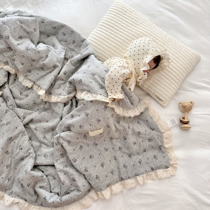 Full view of bear print comforter with lace edges