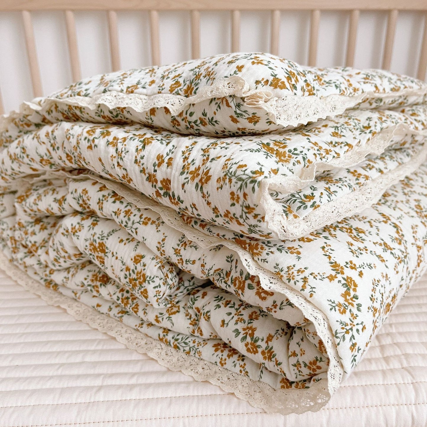 otton baby comforter with mustard floral print