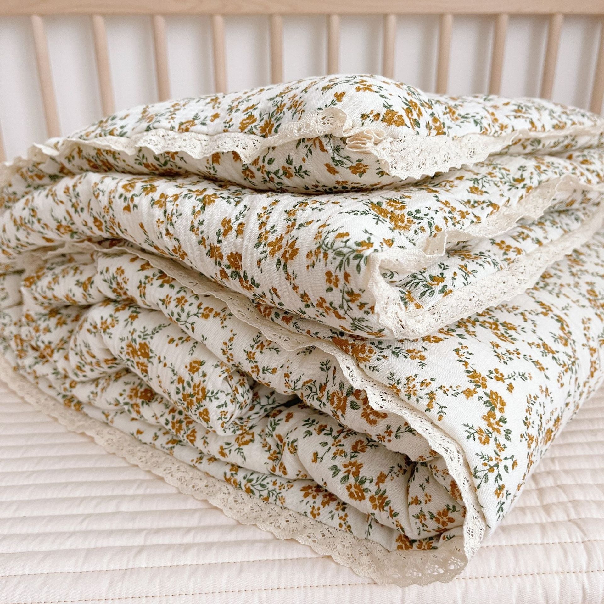 otton baby comforter with mustard floral print