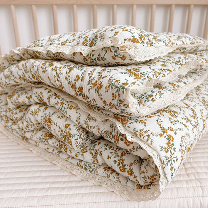 otton baby comforter with mustard floral print
