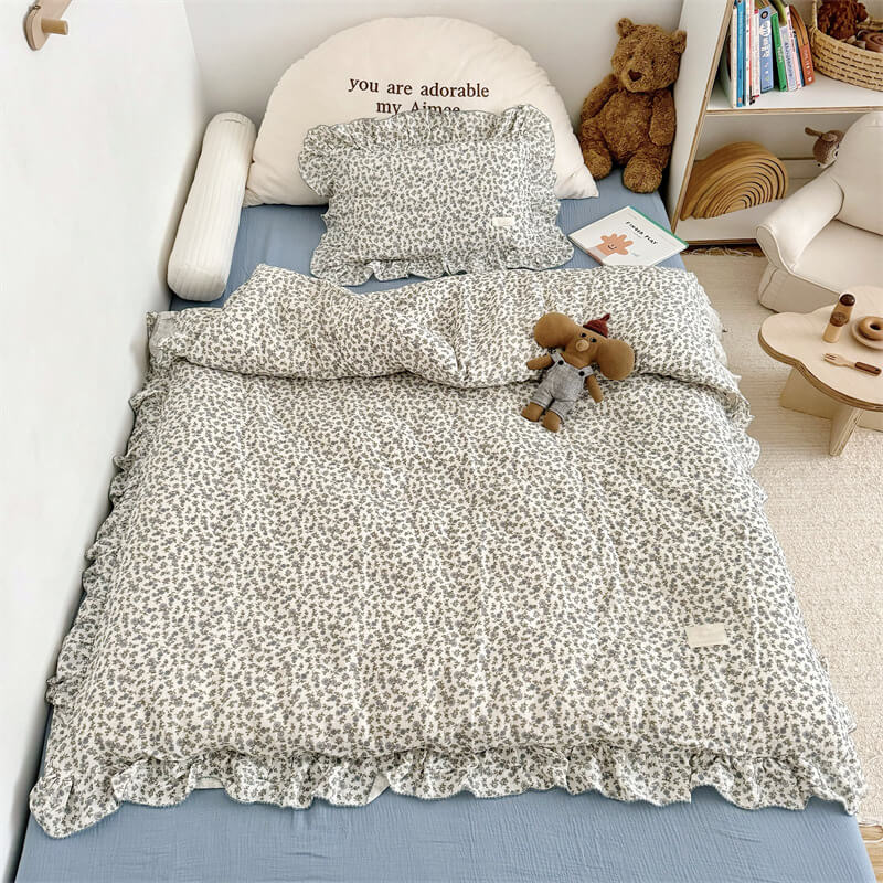 Blue blossom cotton gauze duvet cover set styled on toddler bed — kids duvet cover set