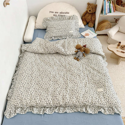 Blue blossom cotton gauze duvet cover set styled on toddler bed — kids duvet cover set