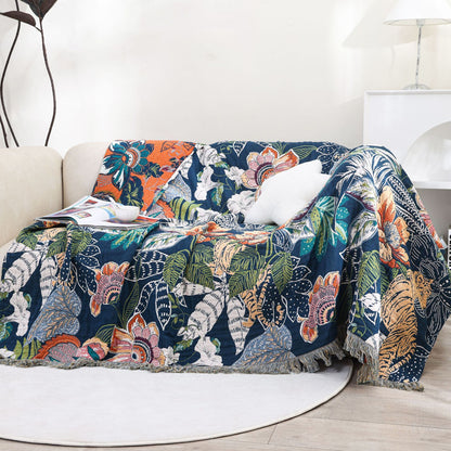Jaguar jungle cotton throw blanket draped over a sofa
