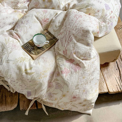 Close-up of crinkled cotton gauze duvet cover in floral blush white