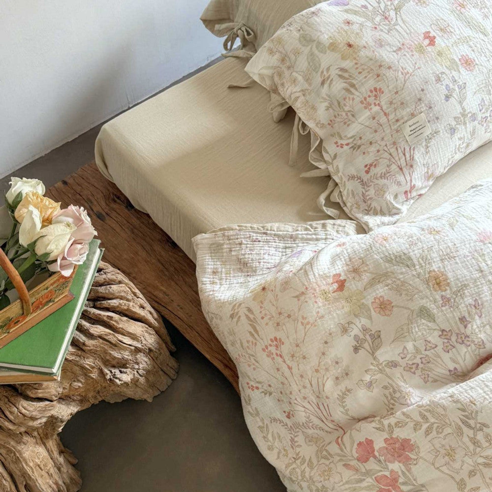 Main image of set in blush white with botanical print and tie closure