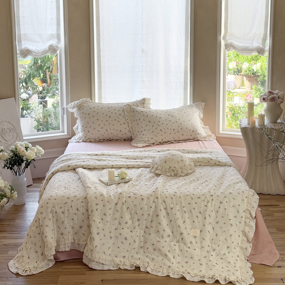 Lightweight floral cotton comforter with lace trim and pink gauze sheets