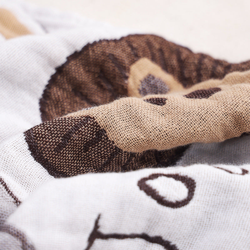 Detailed view of jacquard lion texture on soft cotton gauze