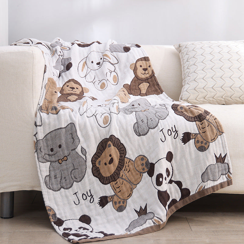 joyful animal  kids blanket displayed on a sofa