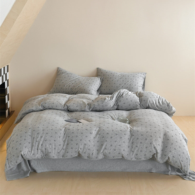 Knit cotton duvet cover with grey bear print styled in bedroom
