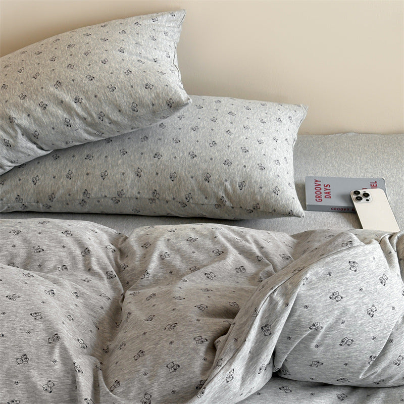Close-up of knit cotton pillowcase with grey bear print