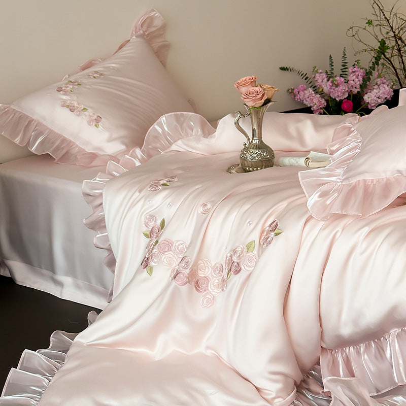 Side view of pink embroidered Tencel bedding