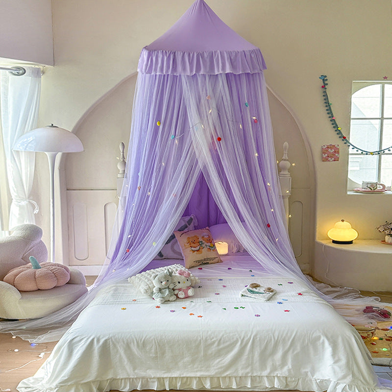 Cozy reading nook with double layer princess bed canopy
