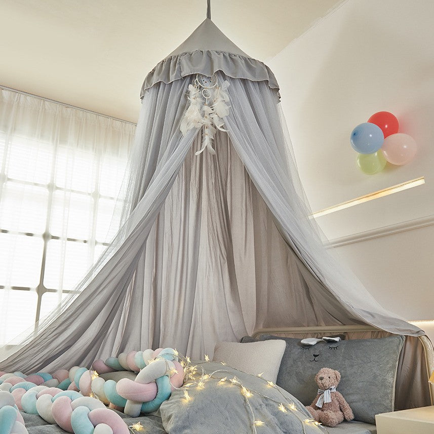 Soft mesh and fabric layers of princess bed canopy