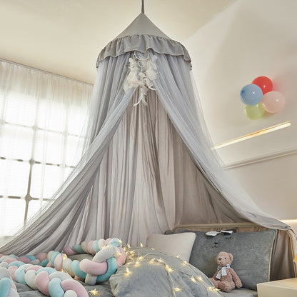 Soft mesh and fabric layers of princess bed canopy