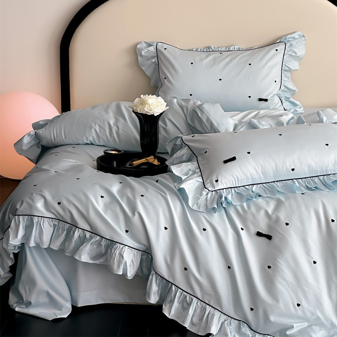 Blue ruffled bedding set with embroidered hearts