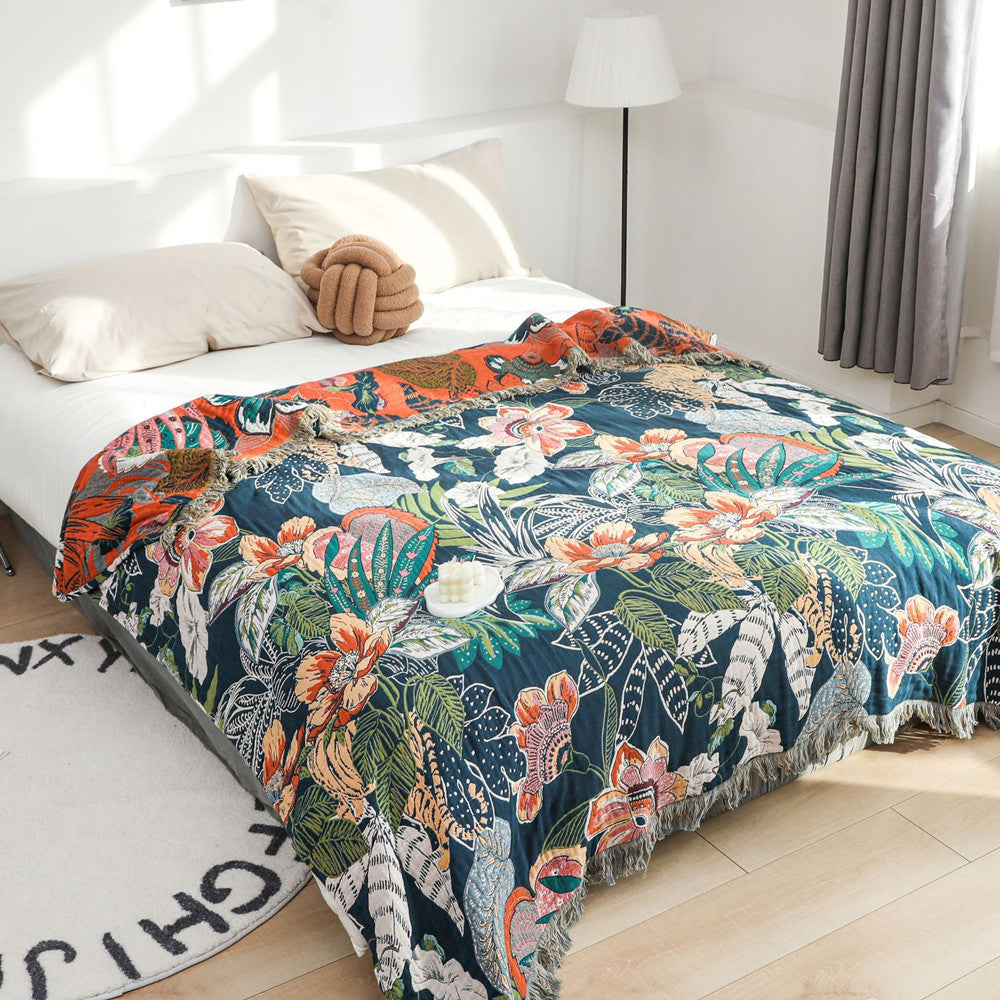 Deep navy jaguar jungle throw blanket styled on a bed