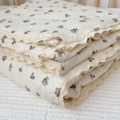 Folded kids comforter with lace trim
