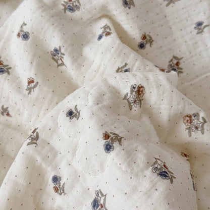 Close-up of floral print and flower quilting