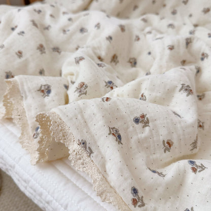 Lace trim detail on cotton gauze comforter
