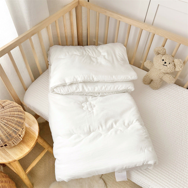 Layered toddler quilt insert in breathable fabric, shown without cover to highlight construction